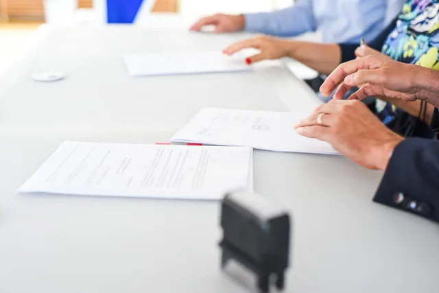 agreement, contract signing, table, hands, sign, contract, paper, paper work, meeting, business, closeup, agreement, contract, contract, contract, contract, contract. Questions for business-to-business demand generation agency: what to ask before signing